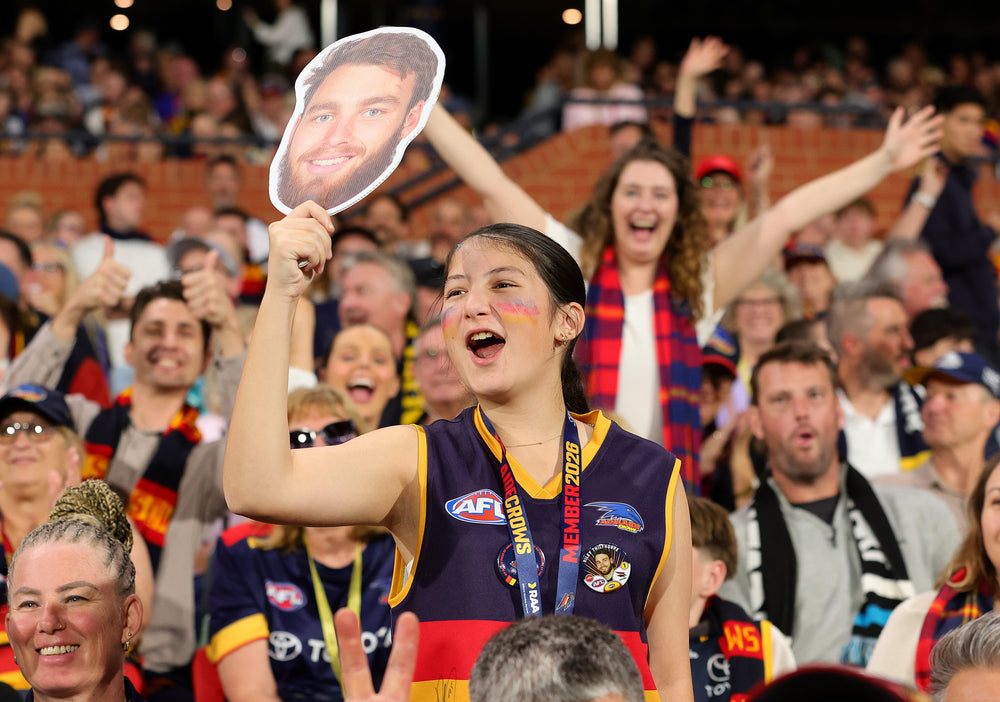 Supporter holding a Sports Head