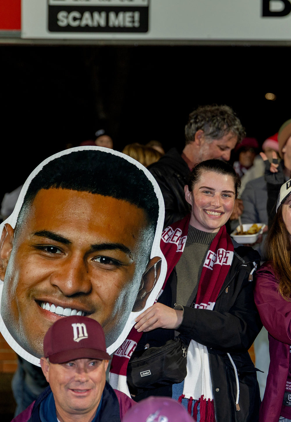 Supporter holding a Sports Head