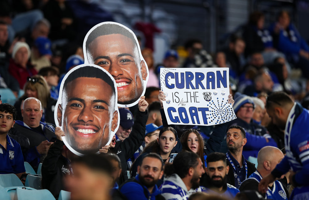 Supporter holding a Sports Head