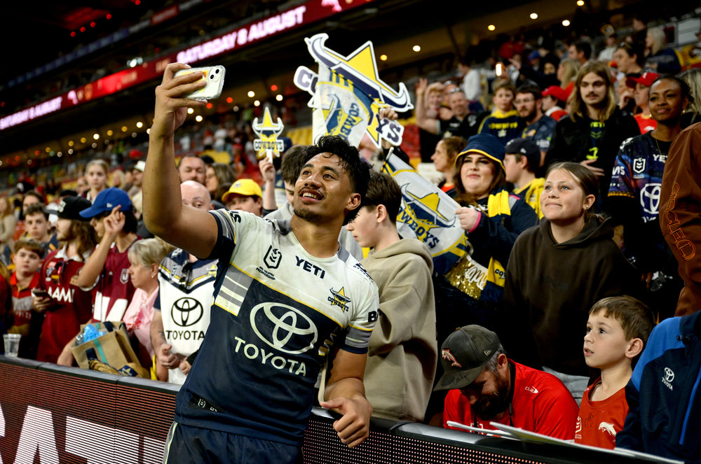 Supporter holding a Sports Head