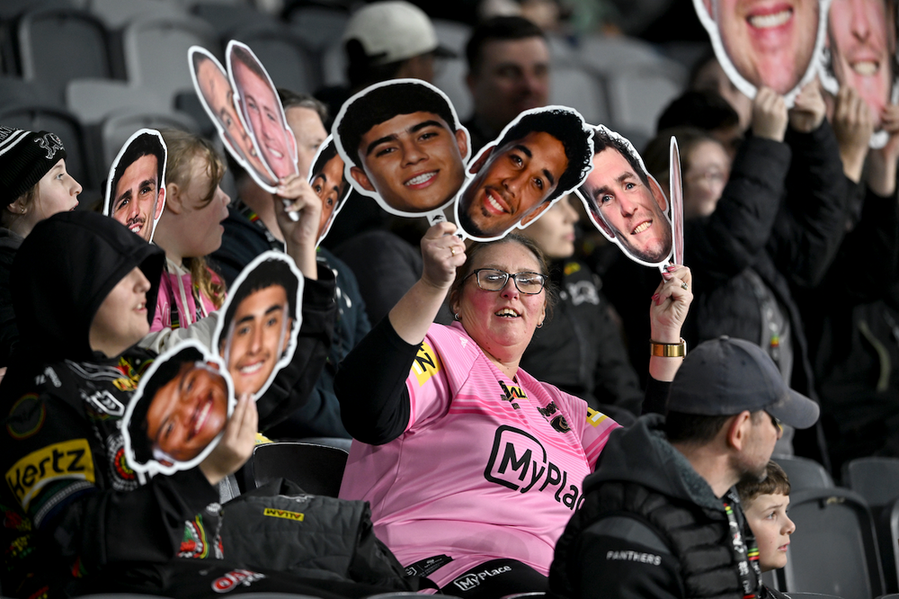 Supporter holding a Sports Head