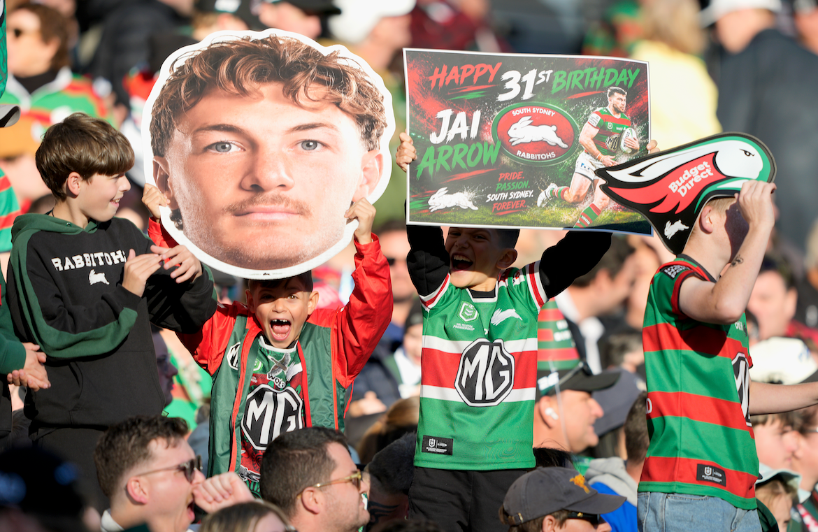 Supporters holding Sports Heads at a live game